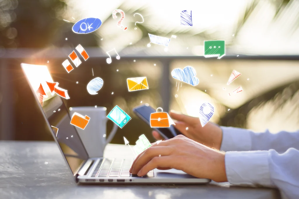 "Marketer using a laptop and smartphone to analyze digital ad performance and diagnose why cost per lead is high."